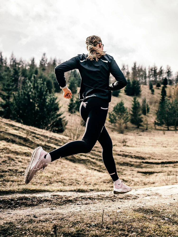 Fusion Women's S1 Run Jacket in Black in action