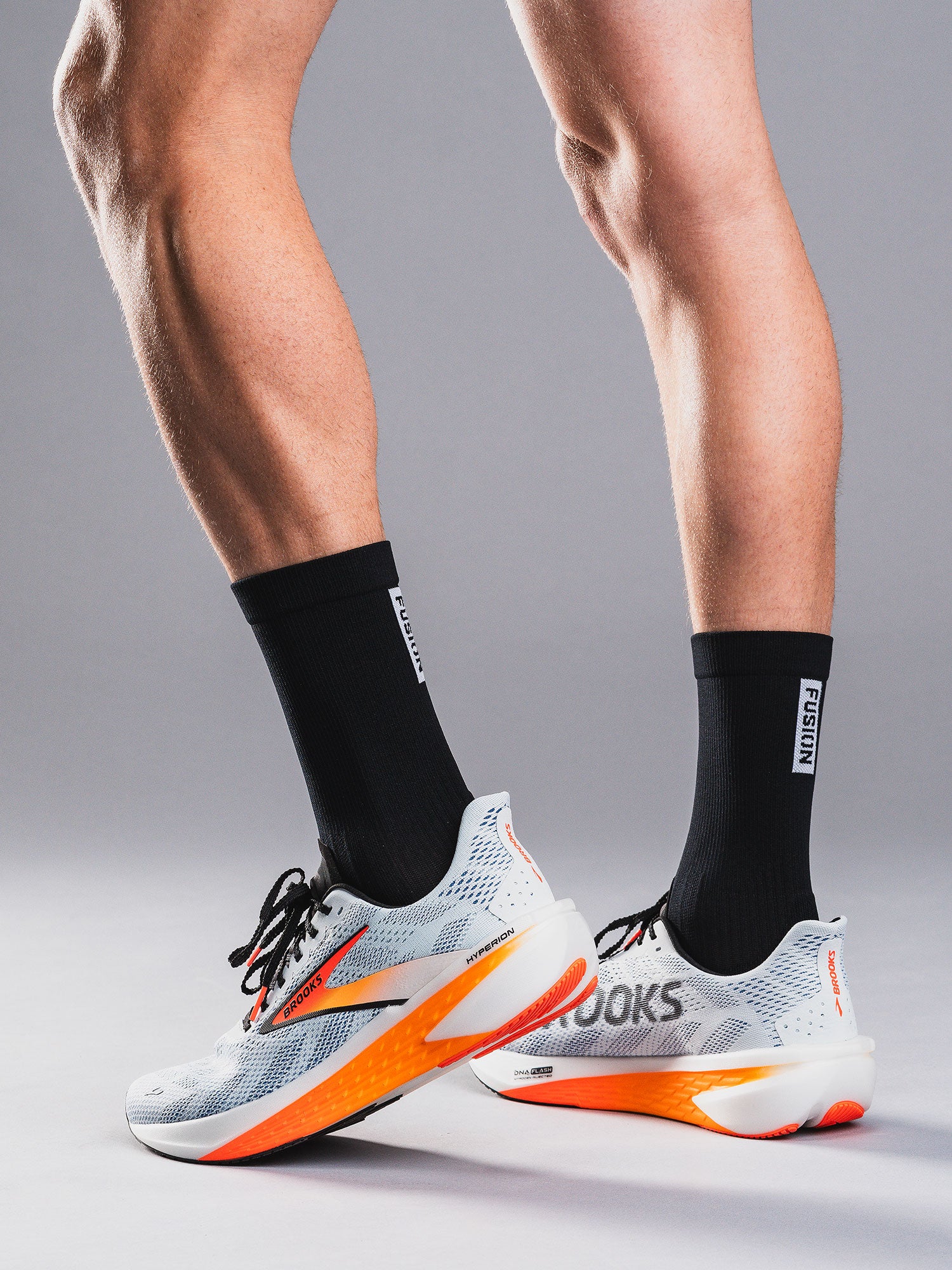 Mens running sock in black with onger length for extra angle support